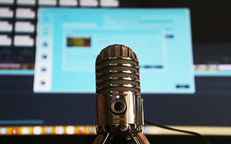 selective focus photography of gray stainless steel condenser microphone